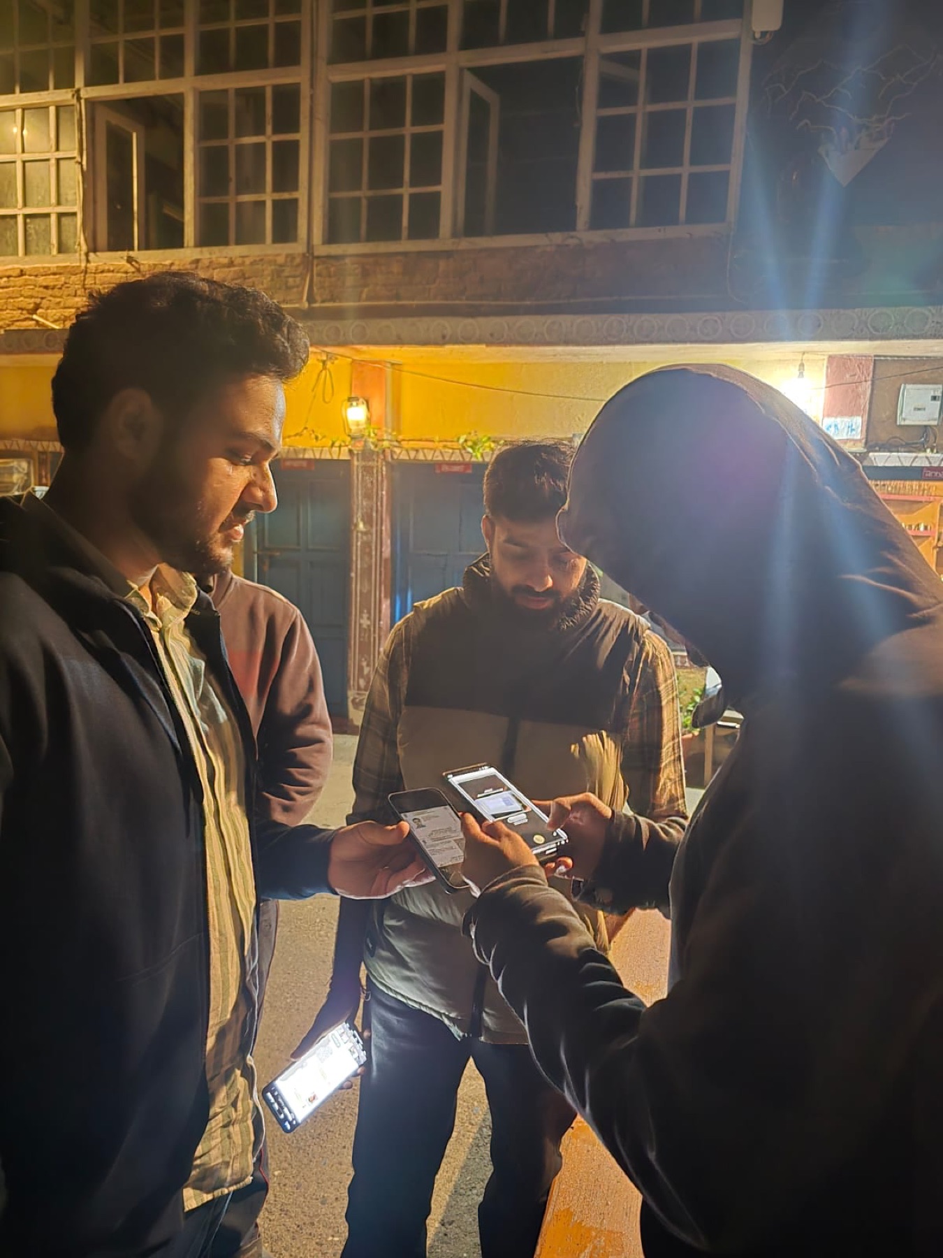 DigiStay's AI verifying a guest ID on a phone on the street at night.